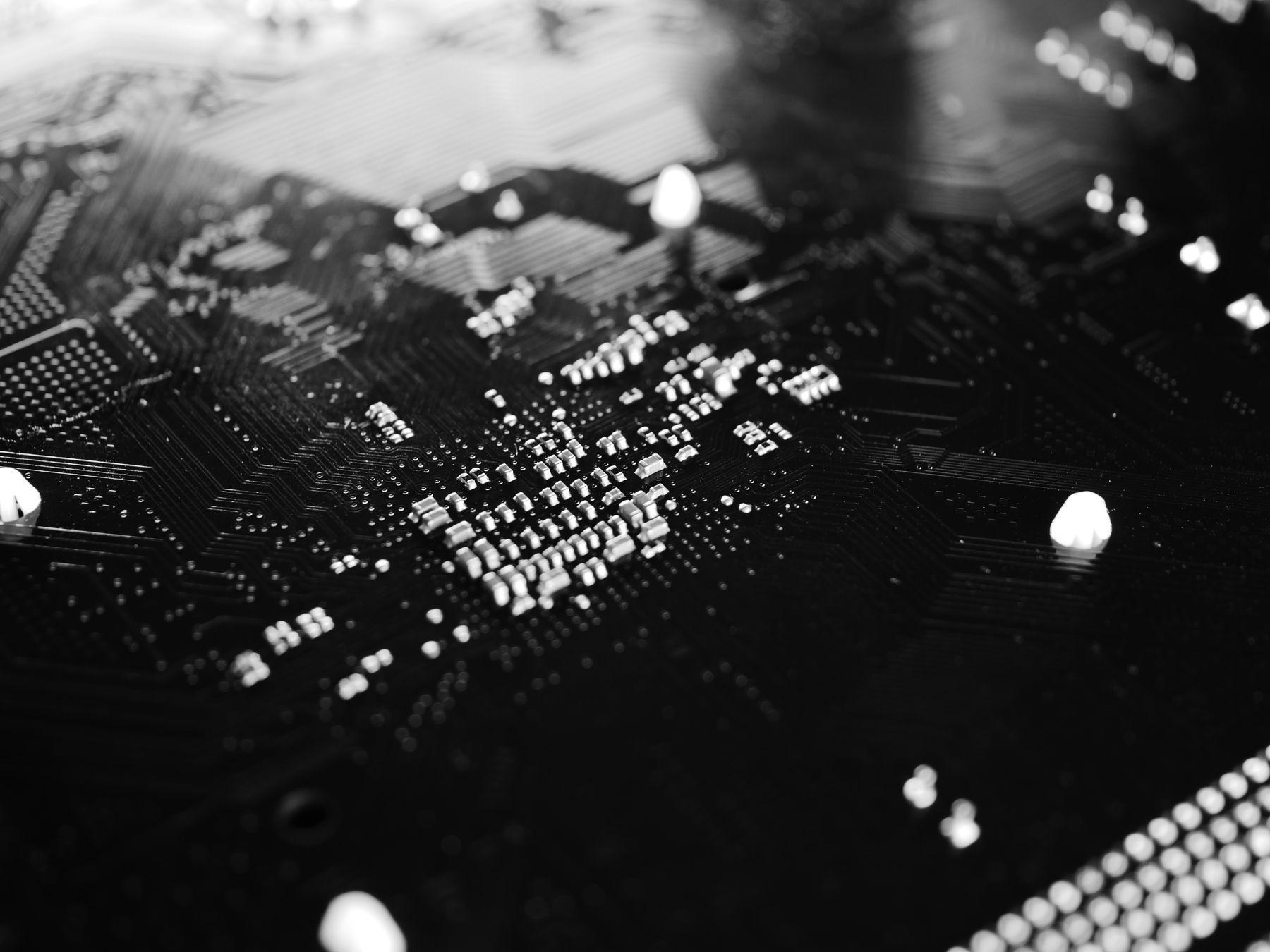Black-and-white macro photograph of a circuit board
