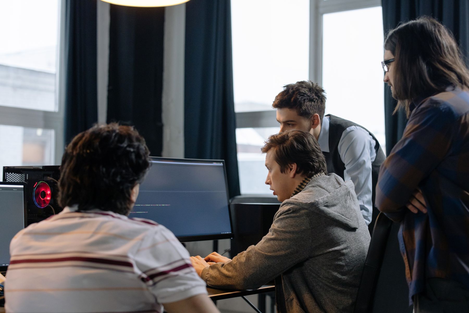 Developers reviewing software together at a workstation